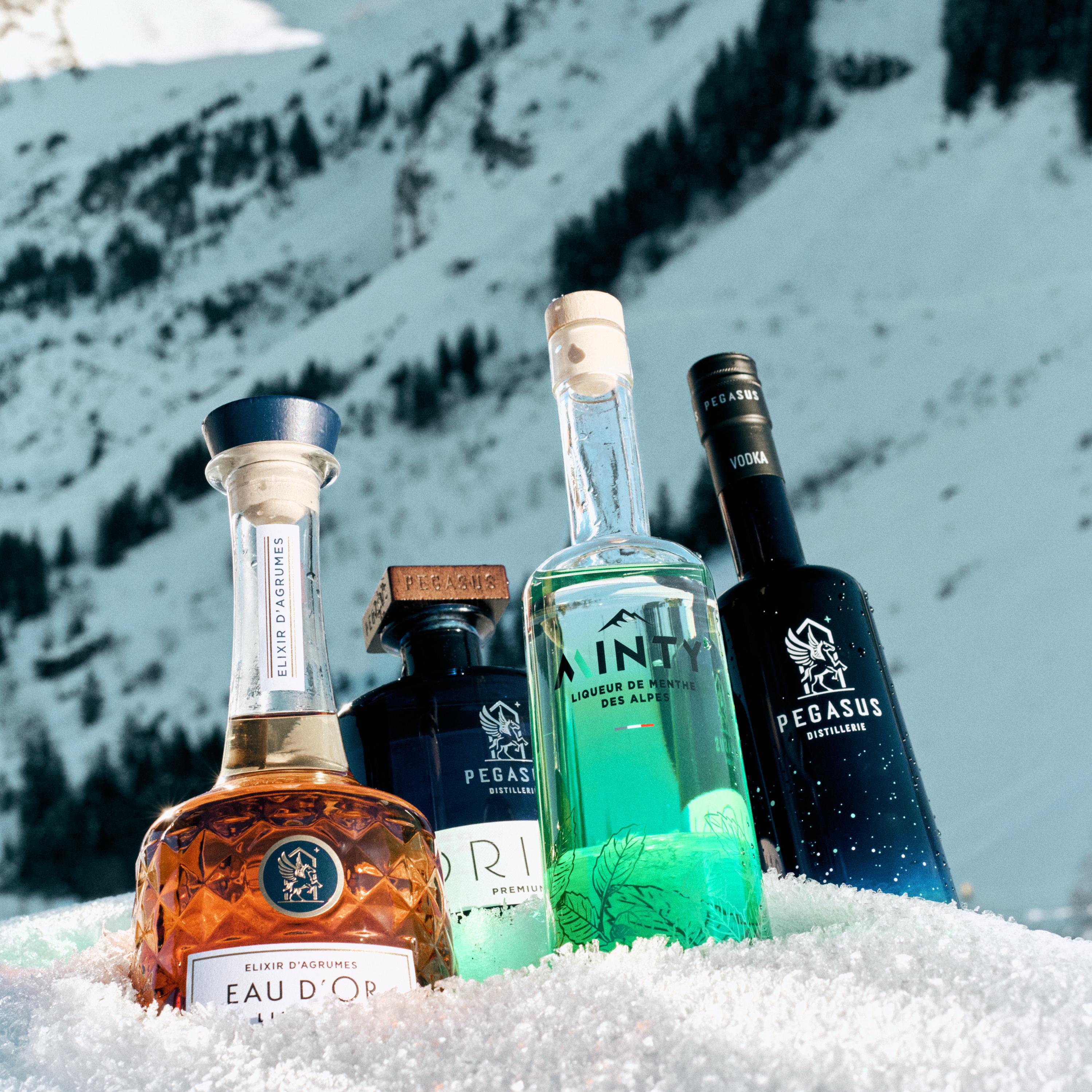 Pegasus Distillery vodka gin and liqueur bottles photographed in the snow