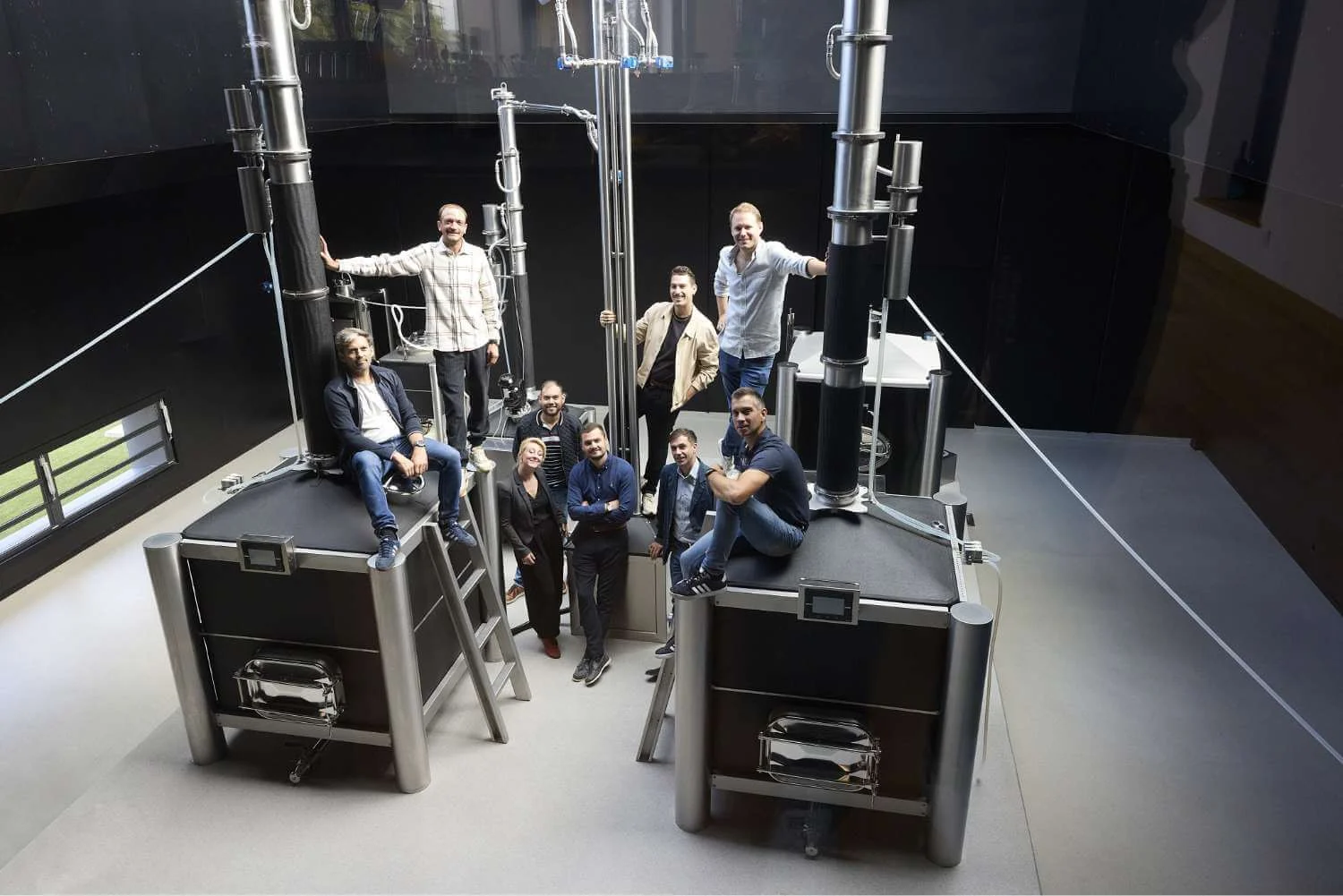 The Pegasus Distillerie team gathered on and around their iStill installation.