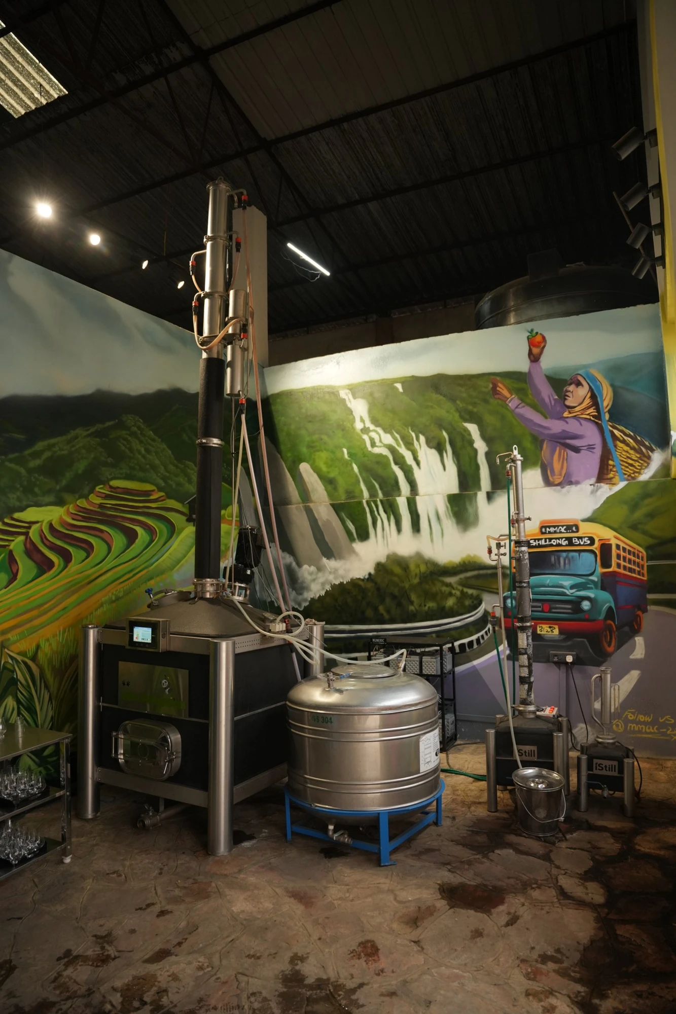 The full-height iStill installation in Cherrapunji’s distillery, backed by the brand’s Meghalaya mural.