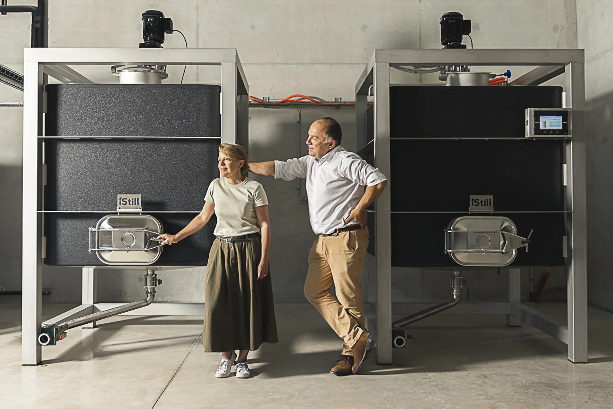 Véronique and Vincent at Distillerie de Soligny beside their iStill equipment