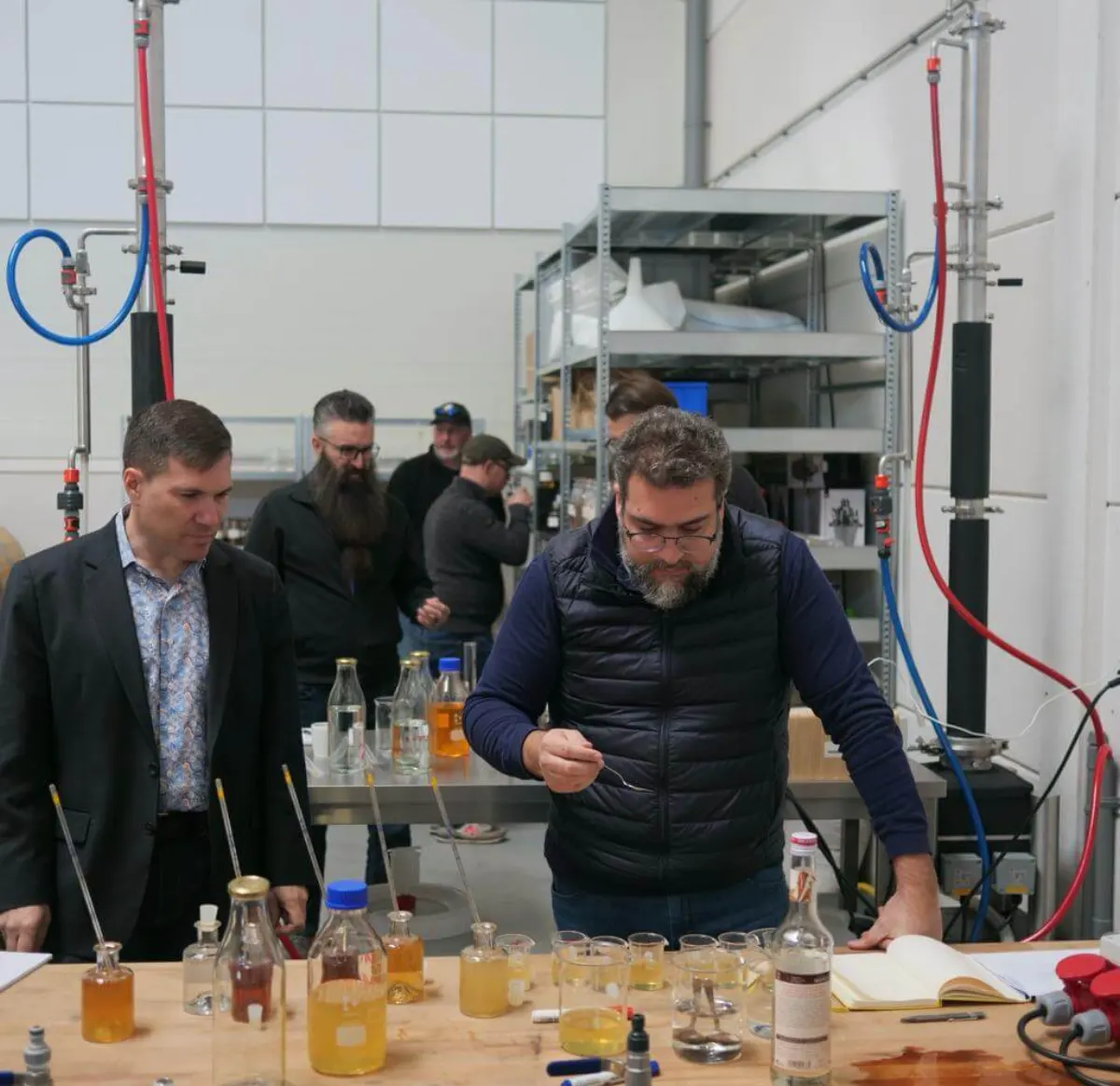 Course participants tasting and evaluating spirits during practical product feedback.