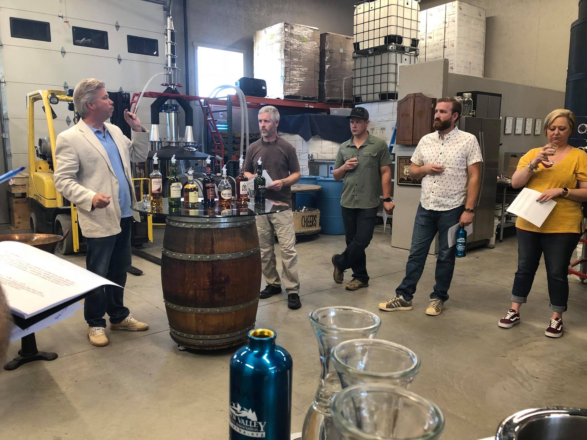 Students help start a new batch of bourbon whisky.