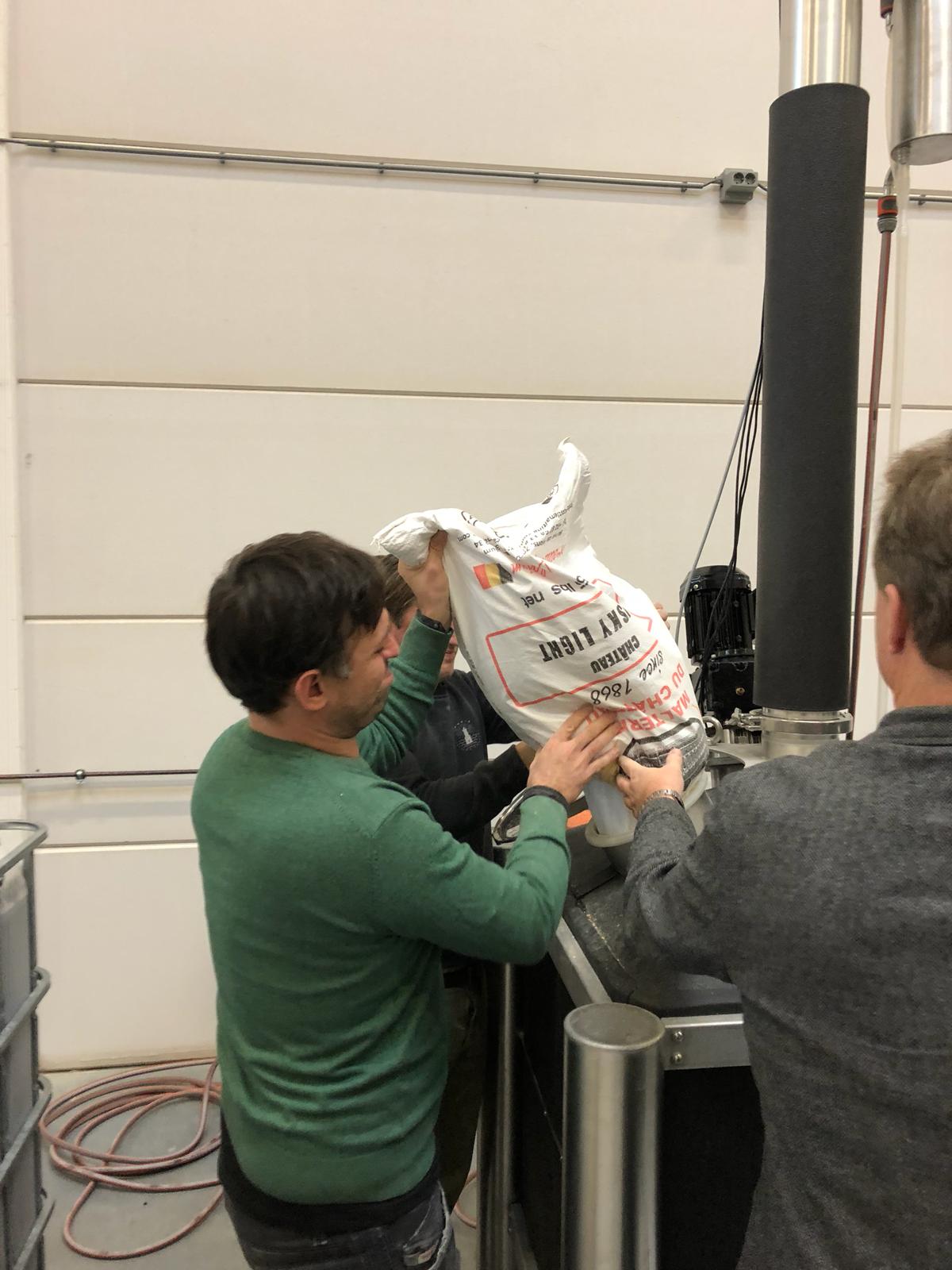 Students add cracked grain to the iStill 500.